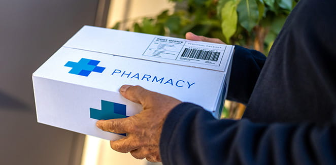 Person delivering pharmacy package.