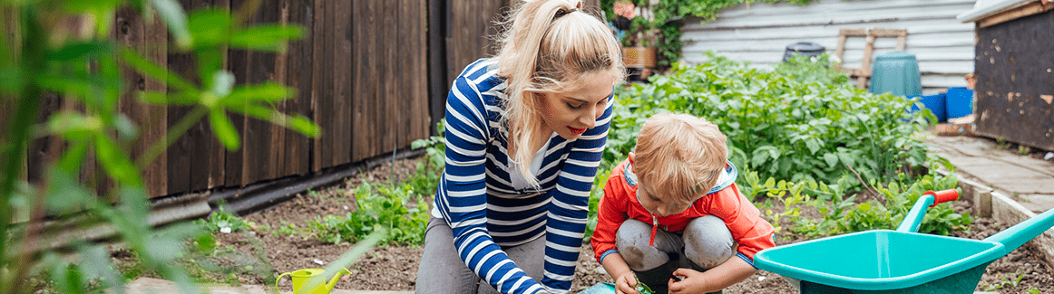 A woman and a child gardening