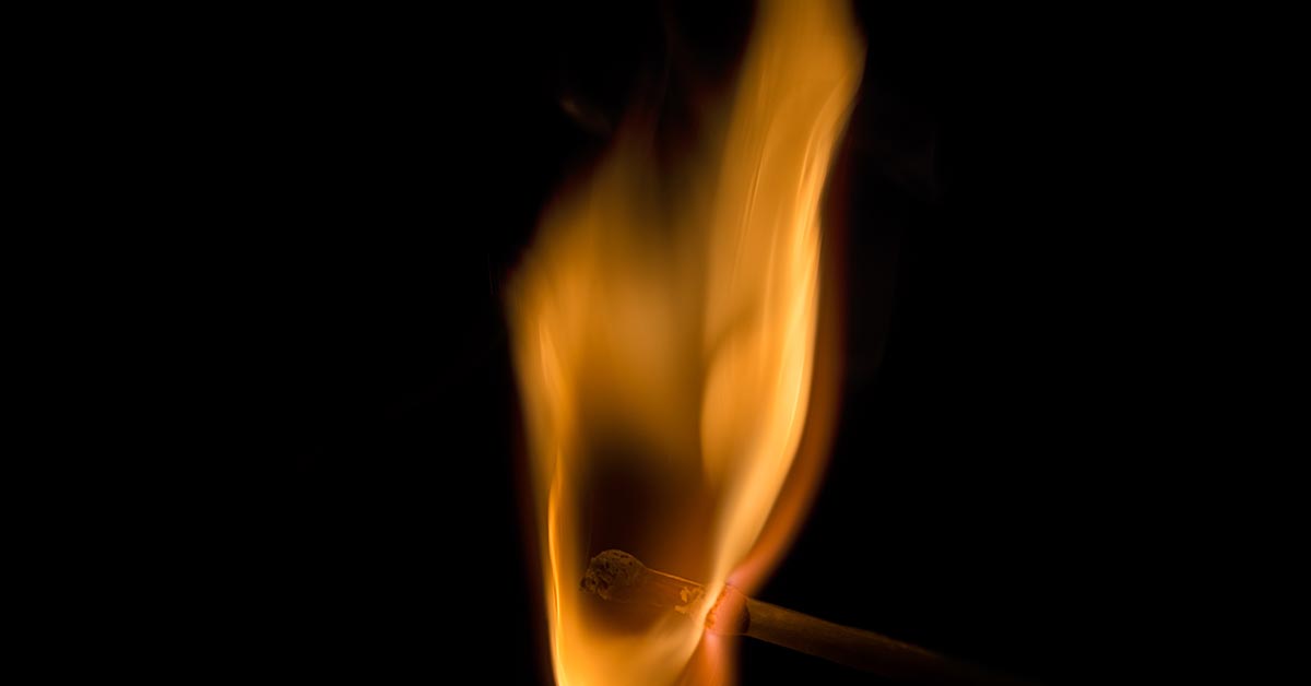 Black background with an orange flame