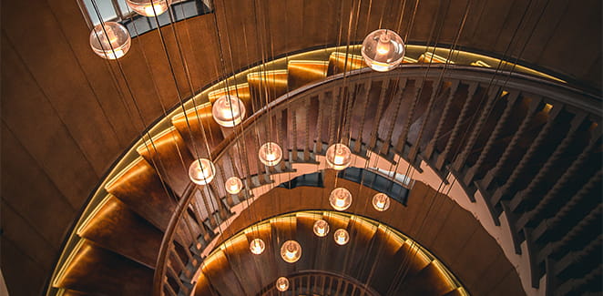 Hanging lights on a spiral staircase