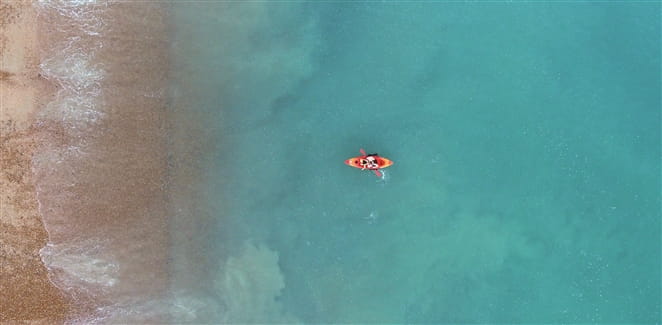 kayak on bright blue water
