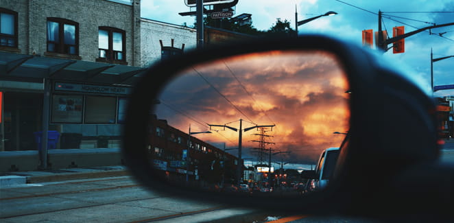 sunset in a rearview mirror